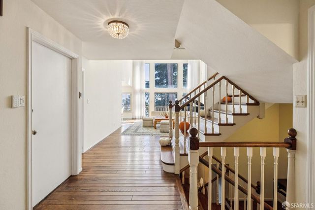 a view of entryway with wooden floor