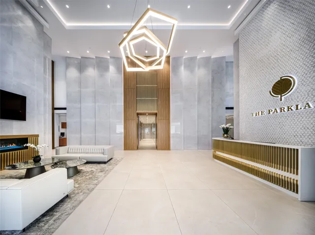 a spacious bedroom with a bed a mirror and a flat screen television