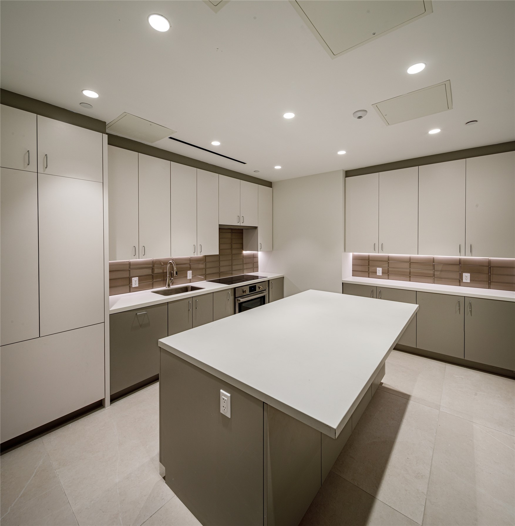 1701 Hermann Drive, Unit 30D Houston, TX 77004 - Photo 29 of 32 a kitchen with stainless steel appliances a refrigerator sink and white cabinets