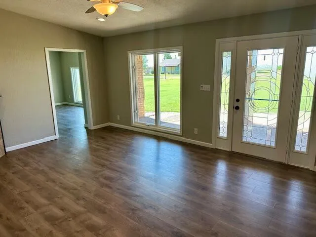 a view of an empty room with a window