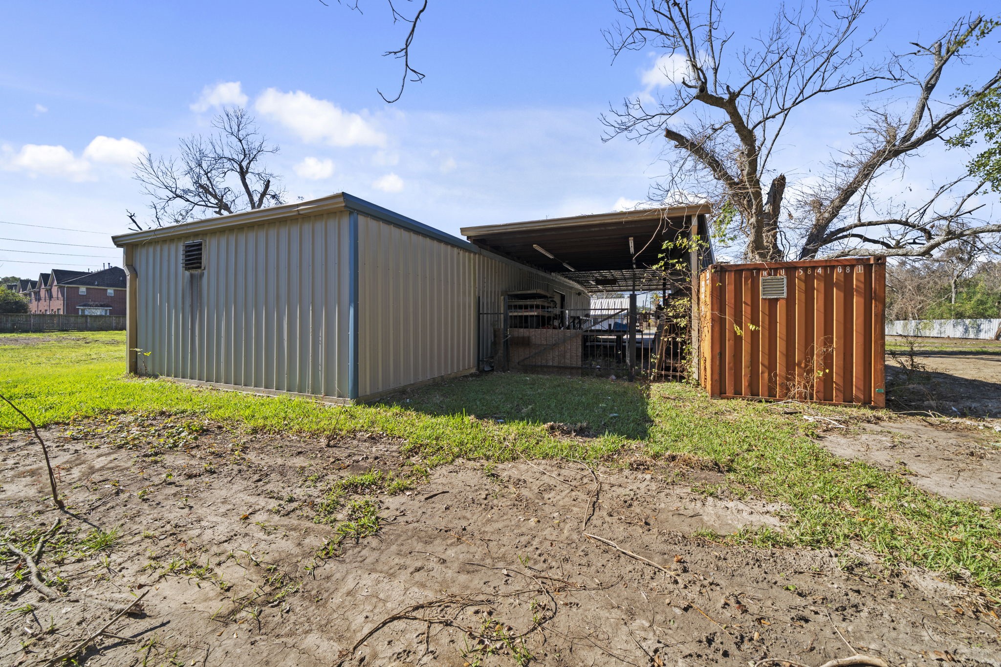 8438 Windfern Road Houston, TX 77040 - Photo 11 of 22 a backyard of a house with a garden and barbeque oven