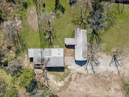 an aerial view of residential house with outdoor space