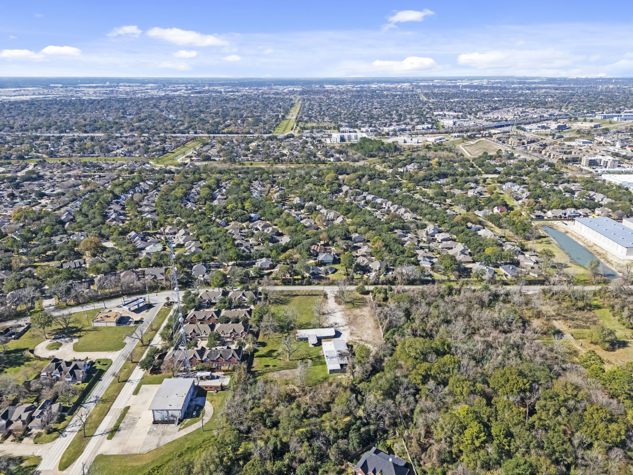 8438 Windfern Road Houston, TX 77040 - Photo 17 of 22 an aerial view of residential houses with outdoor space and trees