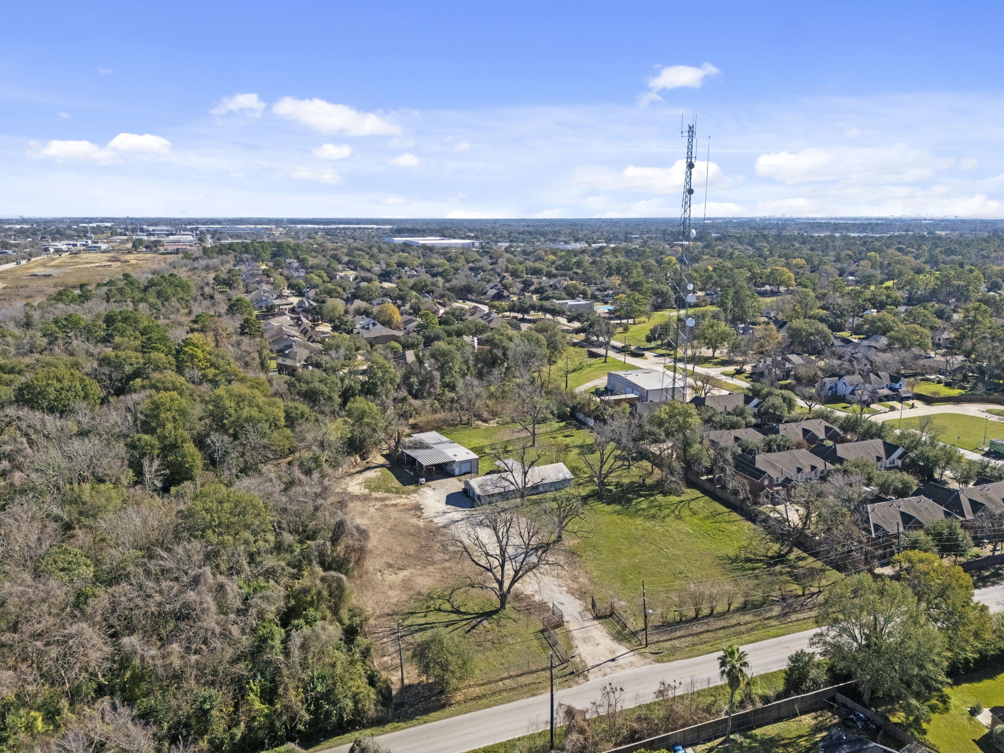 8438 Windfern Road Houston, TX 77040 - Photo 18 of 22 an aerial view of a city with lots of residential buildings