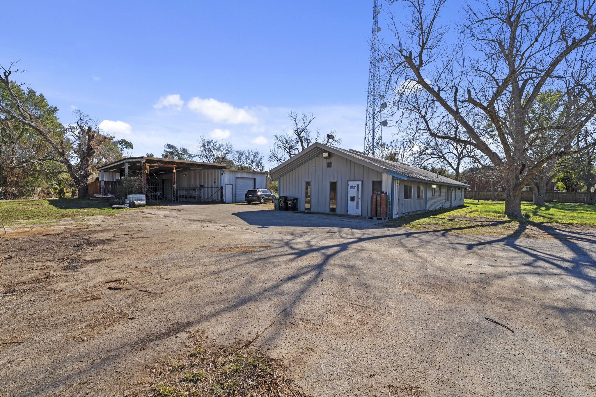 8438 Windfern Road Houston, TX 77040 - Photo 9 of 22 a view of a house with snow on the side of the road