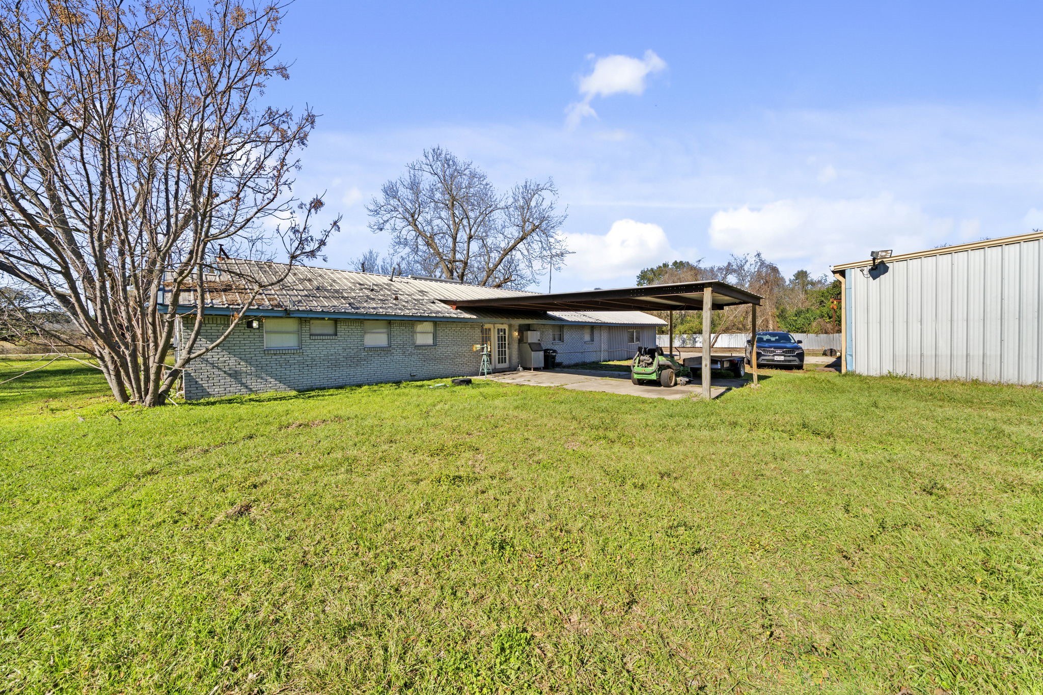 8438 Windfern Road Houston, TX 77040 - Photo 10 of 22 a view of a house with a big yard