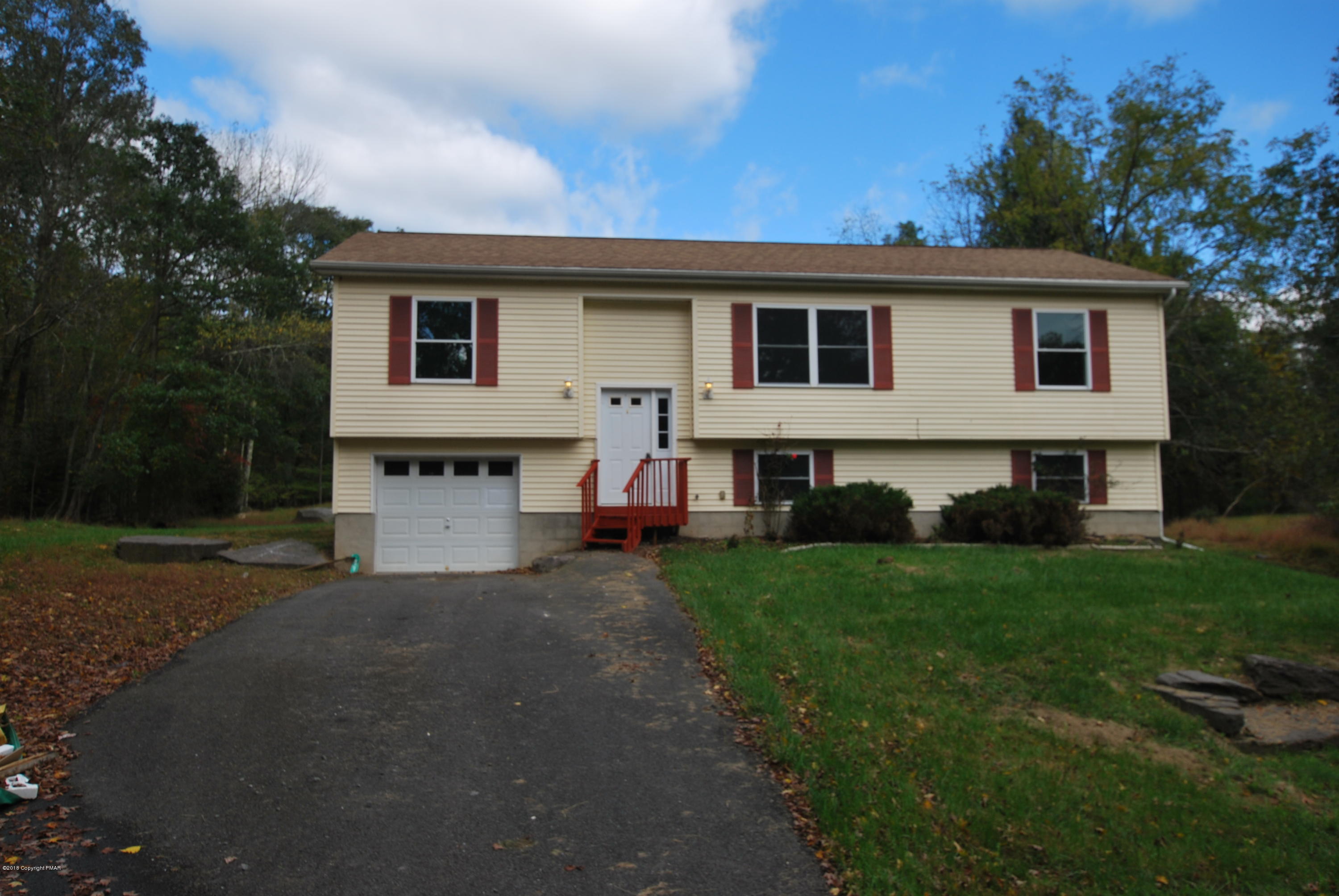 157 Magic Mountain Road Henryville, PA 18332 - Photo 1 of 29 a view of house with a yard