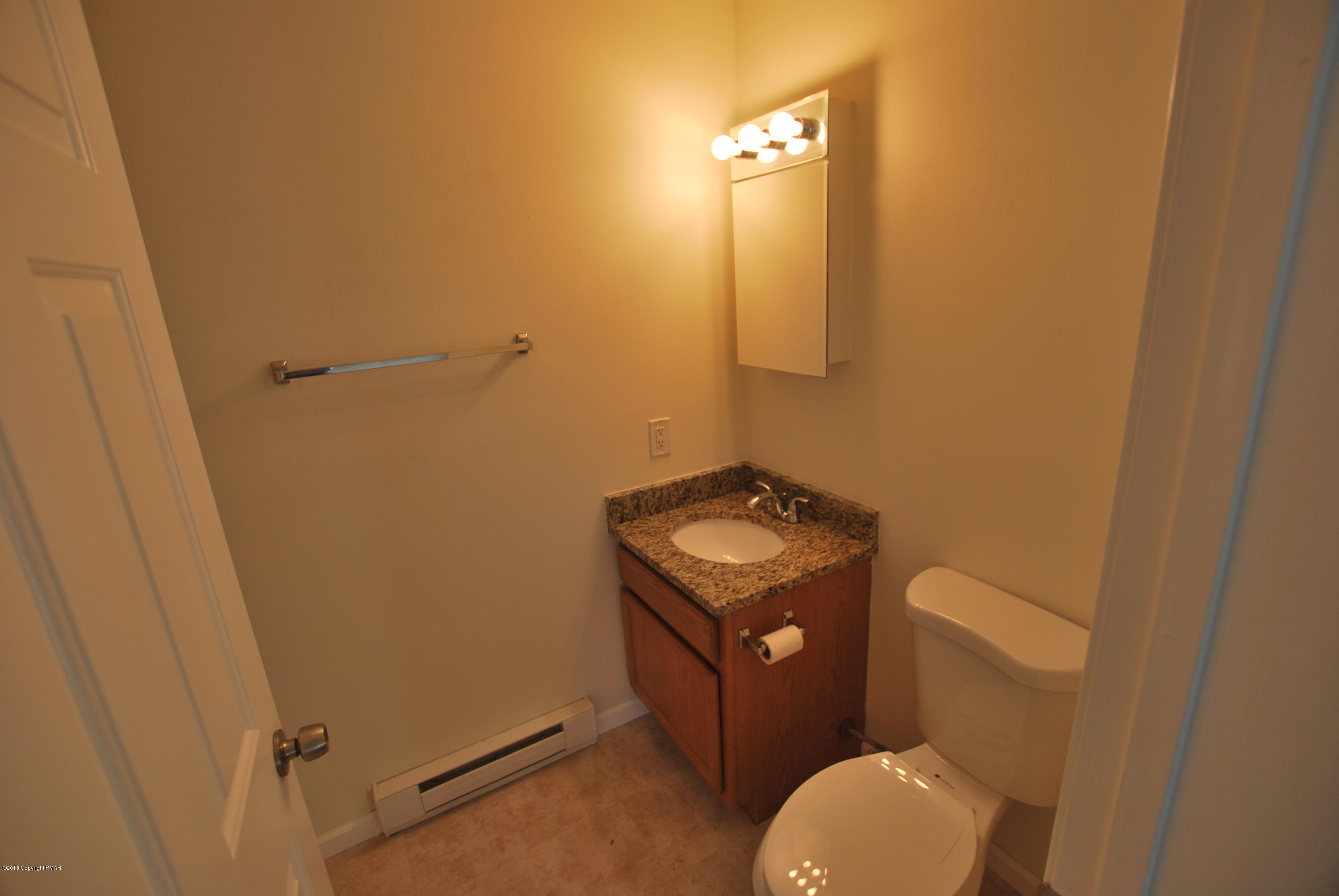 157 Magic Mountain Road Henryville, PA 18332 - Photo 11 of 29 a bathroom with a toilet and a sink