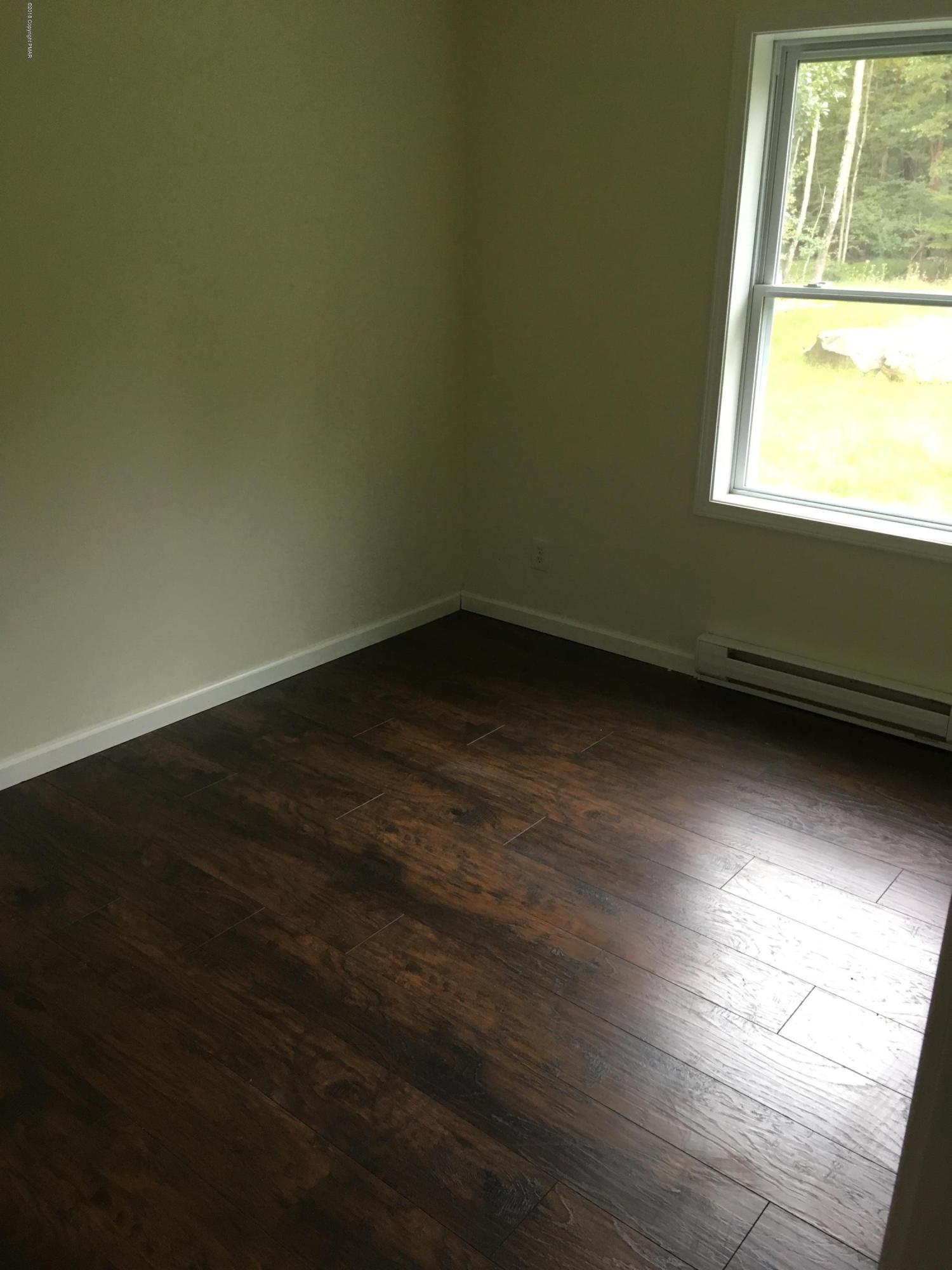 157 Magic Mountain Road Henryville, PA 18332 - Photo 15 of 29 a view of an empty room and window