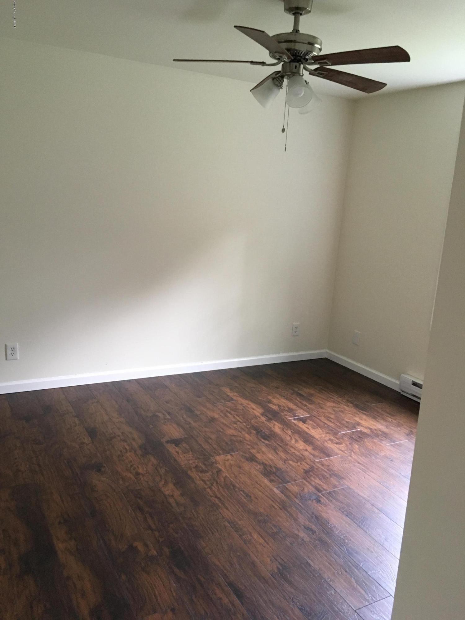 157 Magic Mountain Road Henryville, PA 18332 - Photo 16 of 29 an empty room with a workbench