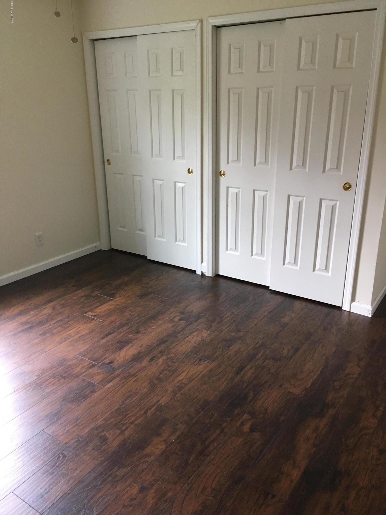 157 Magic Mountain Road Henryville, PA 18332 - Photo 17 of 29 a view of an empty room with wooden floor