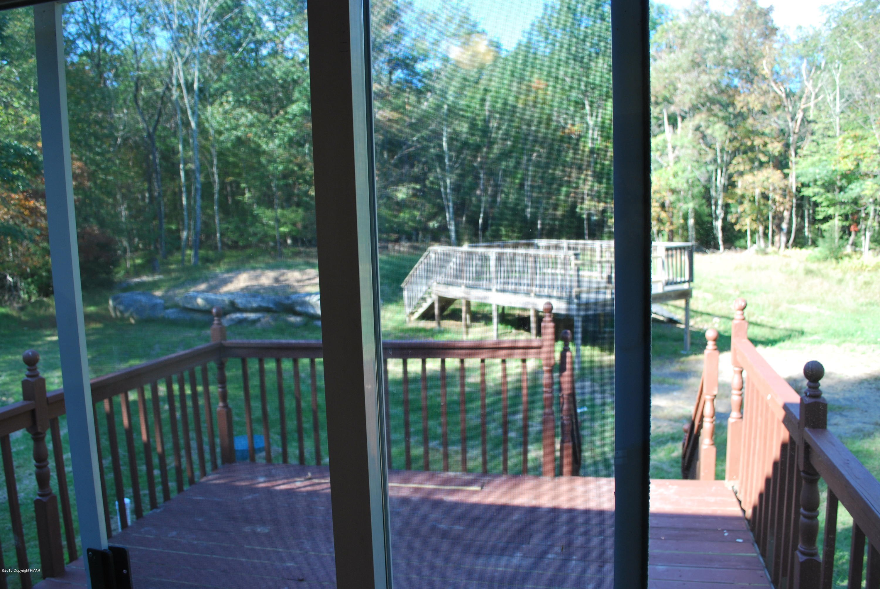157 Magic Mountain Road Henryville, PA 18332 - Photo 24 of 29 a house view with a garden space