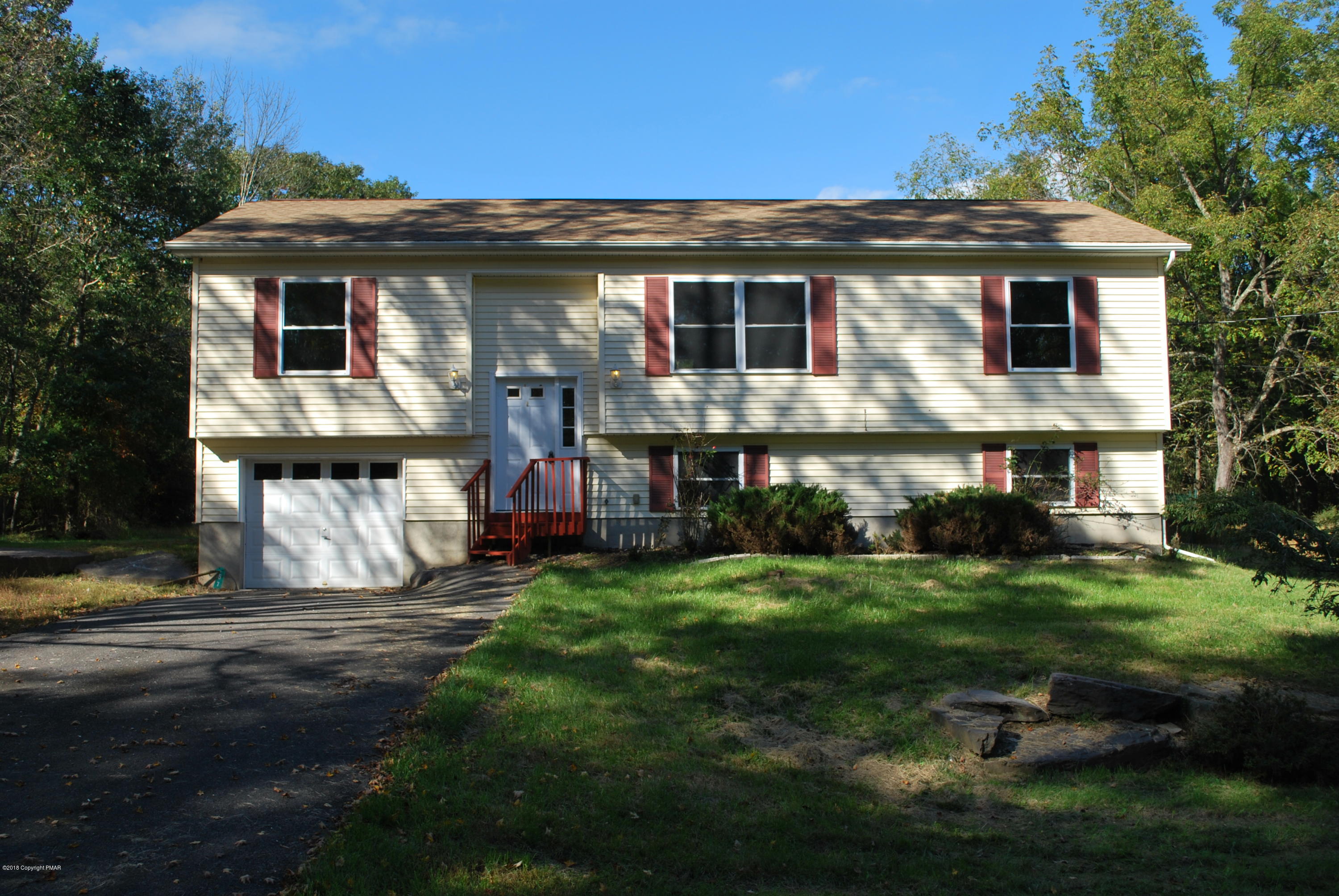 157 Magic Mountain Road Henryville, PA 18332 - Photo 29 of 29 a view of a house with a yard