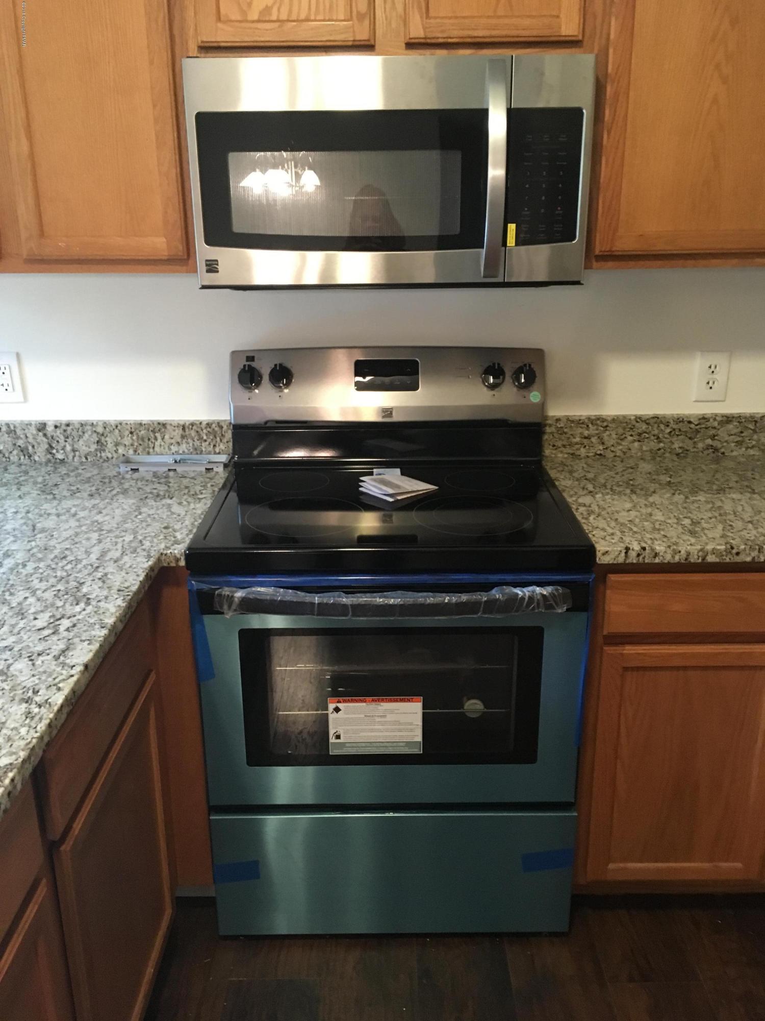 157 Magic Mountain Road Henryville, PA 18332 - Photo 7 of 29 a stove top oven sitting inside of a kitchen
