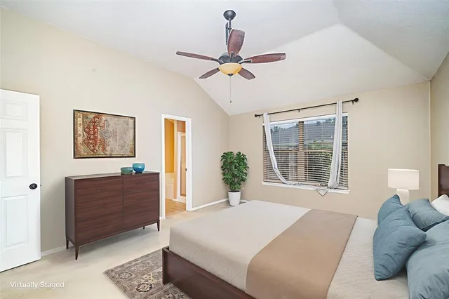 a bed room with a bed and a window