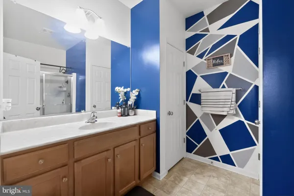 a bathroom with a sink and mirror