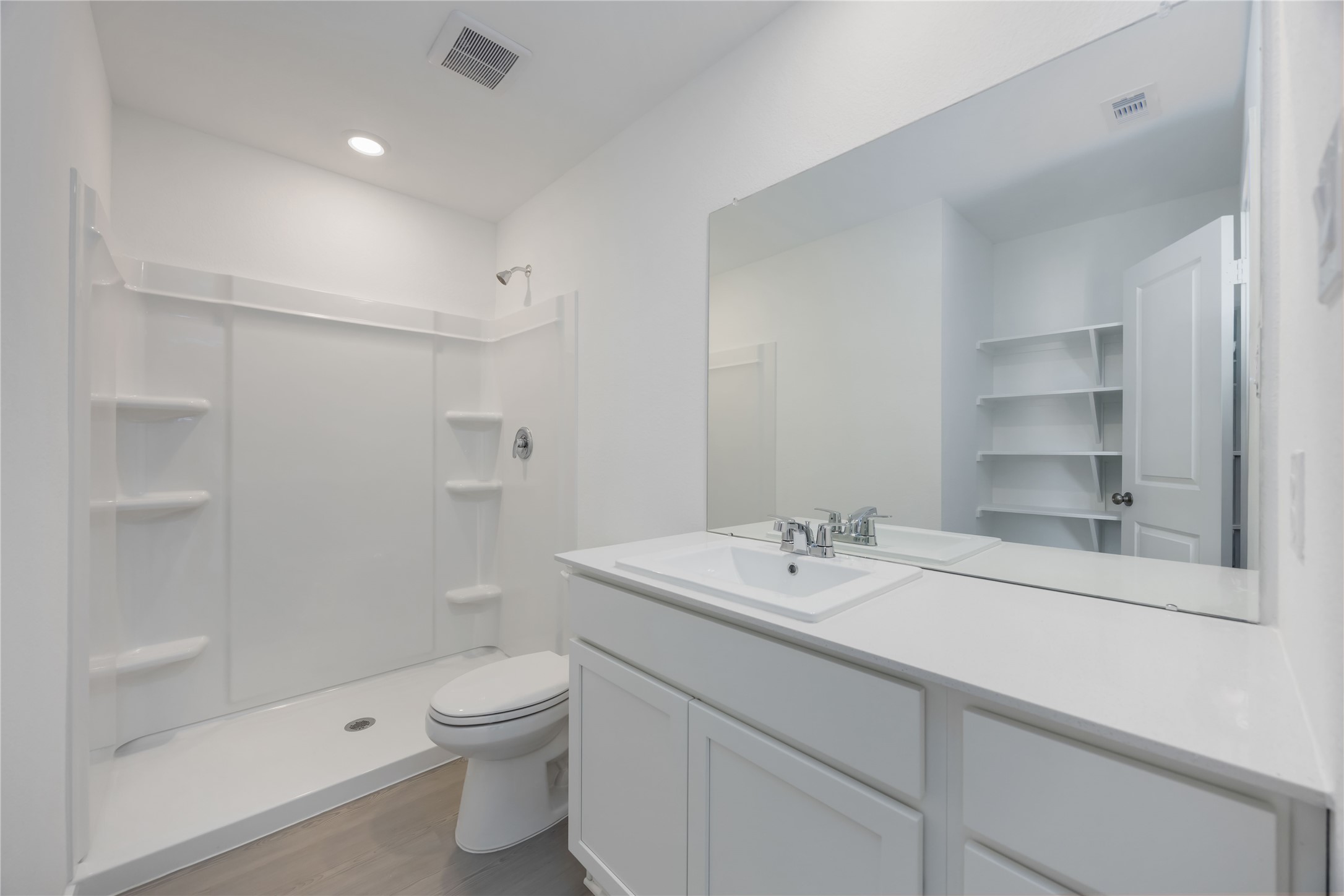 385 Lucia Way Cleveland, TX 77327 - Photo 25 of 30 a bathroom with a sink a toilet and shower