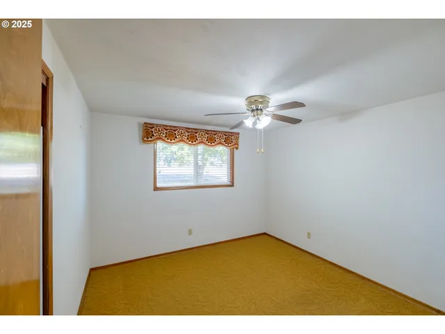 a view of closet with wooden floor