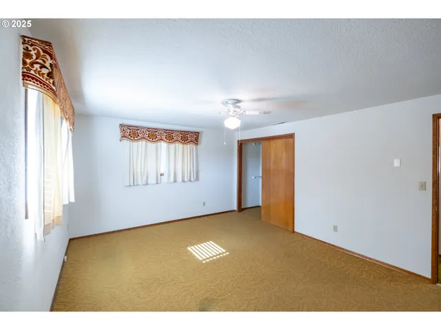 a bathroom with a tub shower and a sink