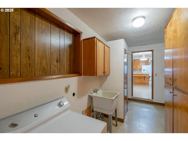 a view of a house with backyard porch and sitting area