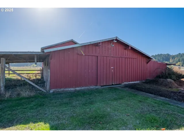 a backyard of a house with lots of green space and plants