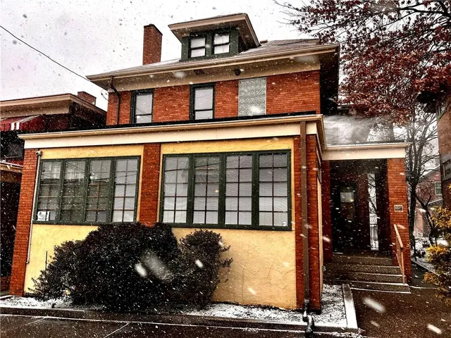 a car parked in front of a house