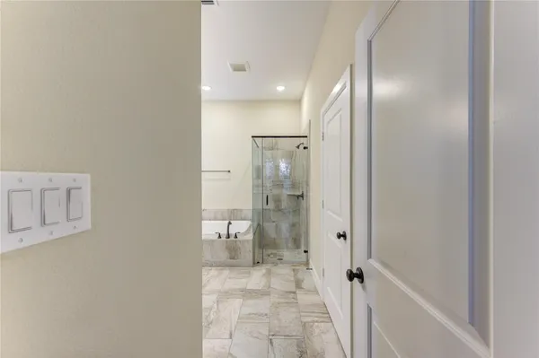 a bathroom with a granite countertop sink mirror and shower
