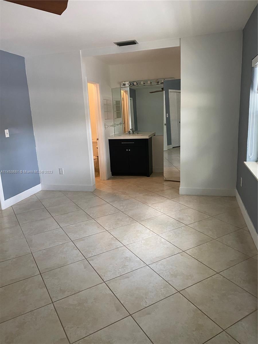 7262 Jacaranda Lane, Unit 7262 Miami Lakes, FL 33014 - Photo 4 of 9 a view of a utility room and window