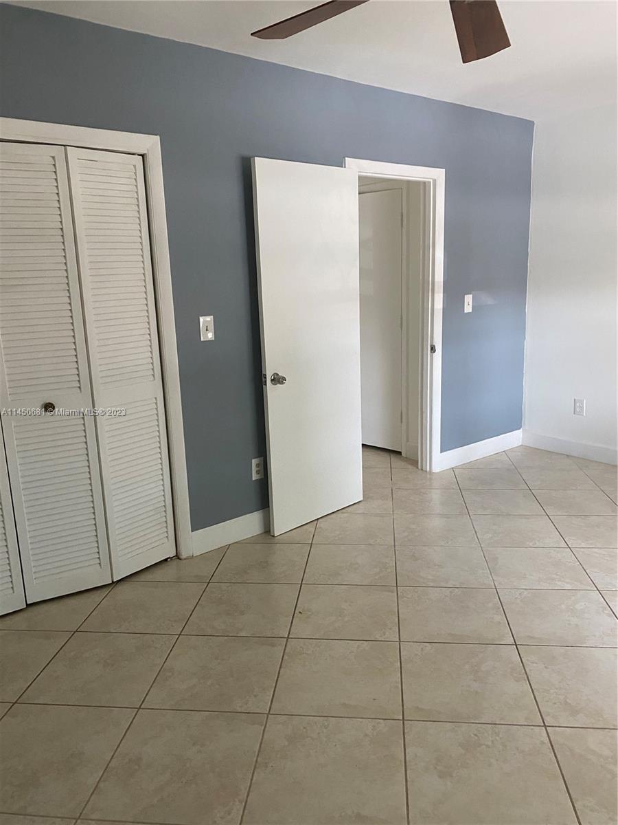 7262 Jacaranda Lane, Unit 7262 Miami Lakes, FL 33014 - Photo 7 of 9 a view of a livingroom with an empty space