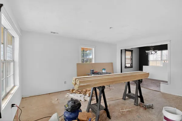 a workspace with furniture and window