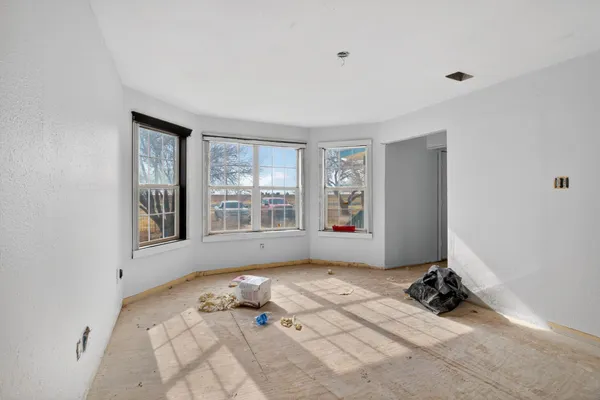 a room with a bed and a window