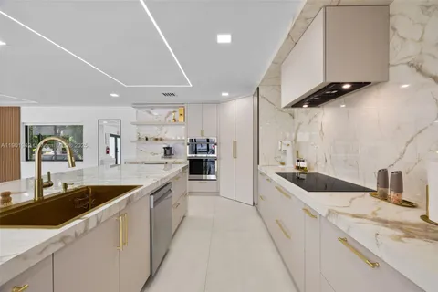 a kitchen with a sink and cabinets