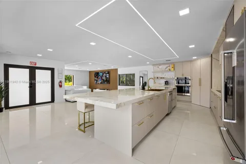 a view of a livingroom with workspace and a window