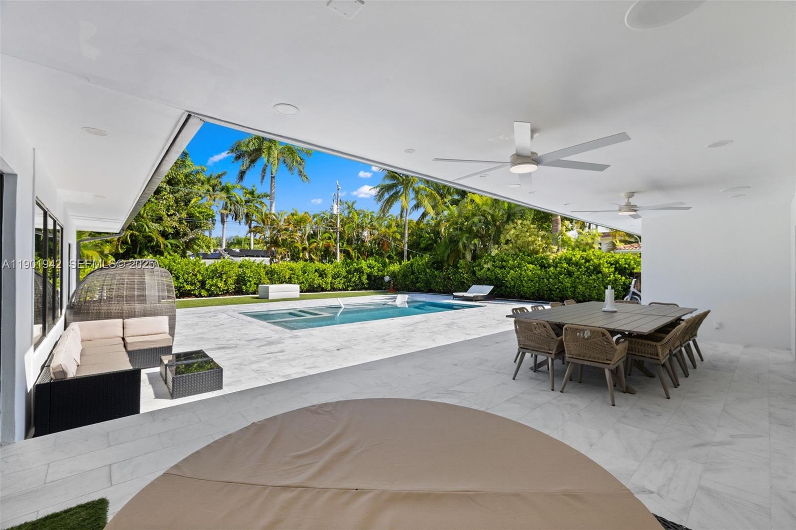 1117 Adams Street Hollywood, FL 33019 - Photo 37 of 64 a swimming pool with outdoor seating and yard