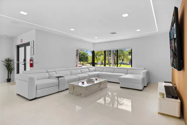 a living room with furniture and a rug