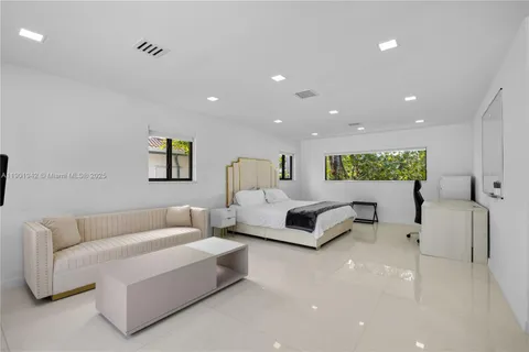 a view of house with outdoor space and swimming pool