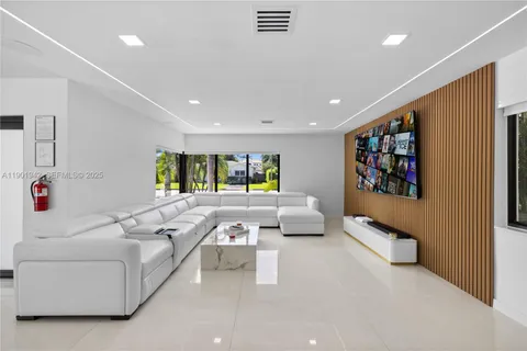 a living room with furniture and a rug