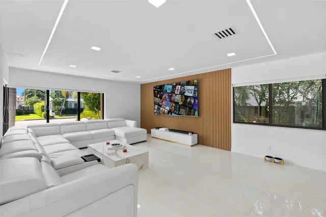 a living room with furniture and a table