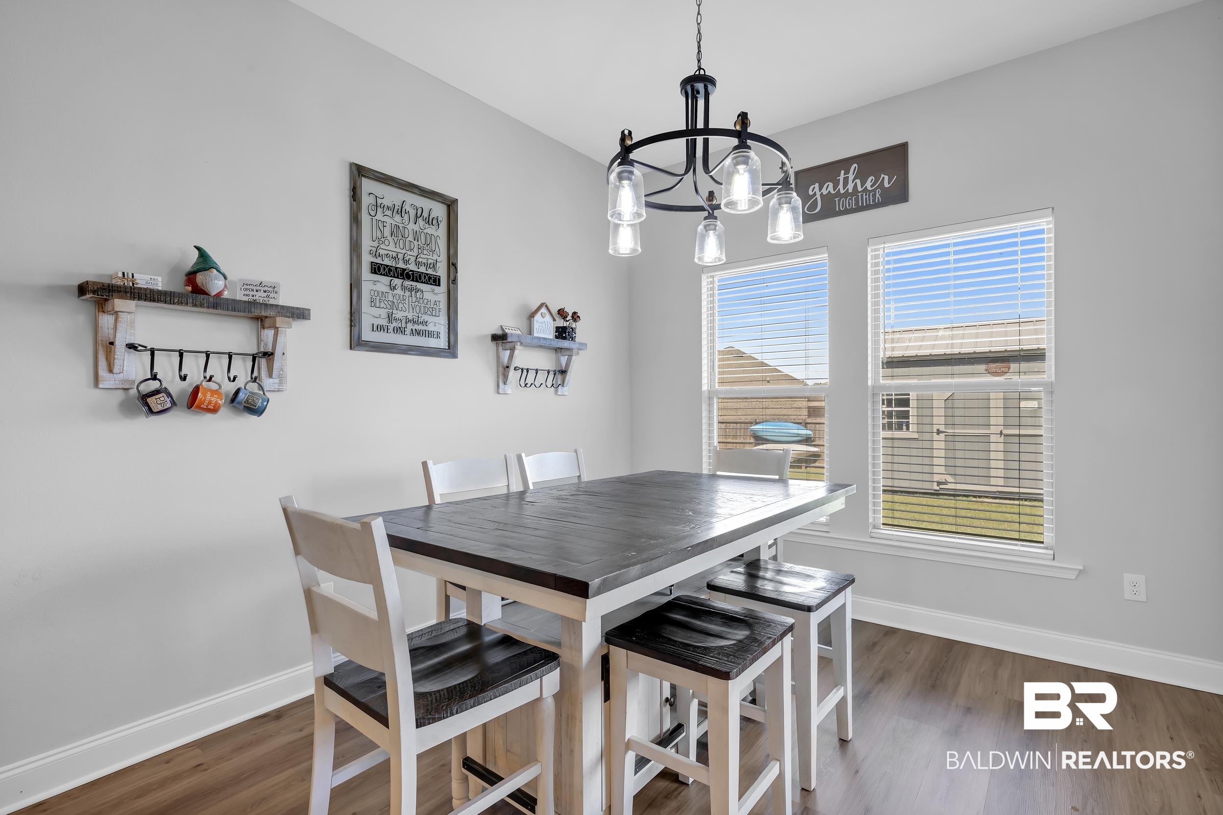 1176 Stella Road Foley, AL 36535 - Photo 14 of 40 Dining room with wood finished floors and a chandelier