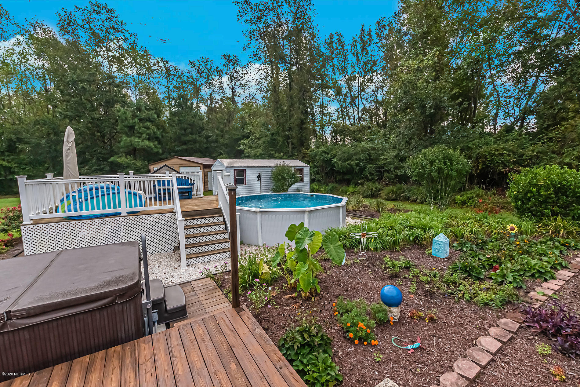 289 Lester Watts Road Tabor City, NC 28463 - Photo 20 of 29 Lower deck with view of hot tub and pool