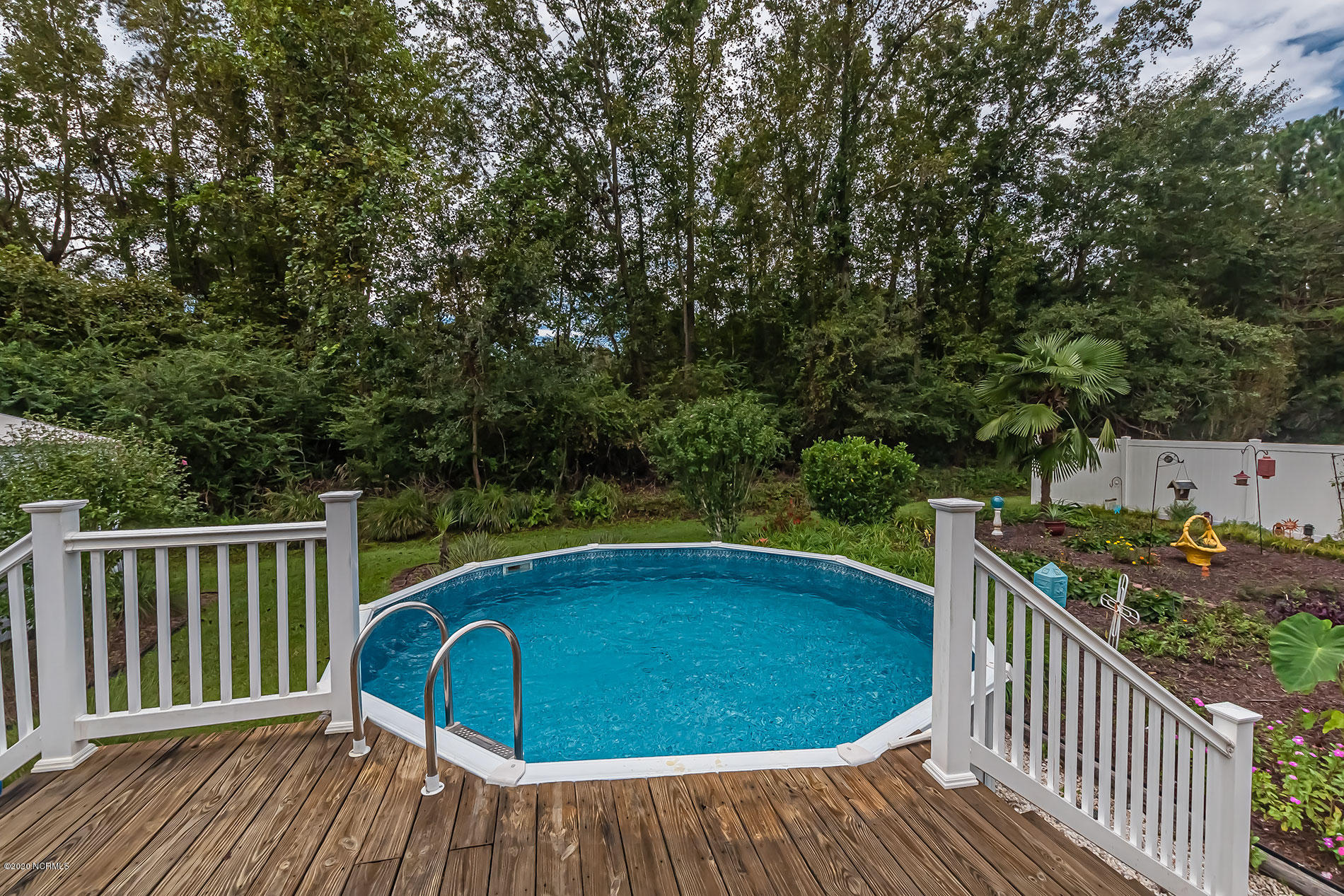 289 Lester Watts Road Tabor City, NC 28463 - Photo 21 of 29 Above ground pool with deck for seating