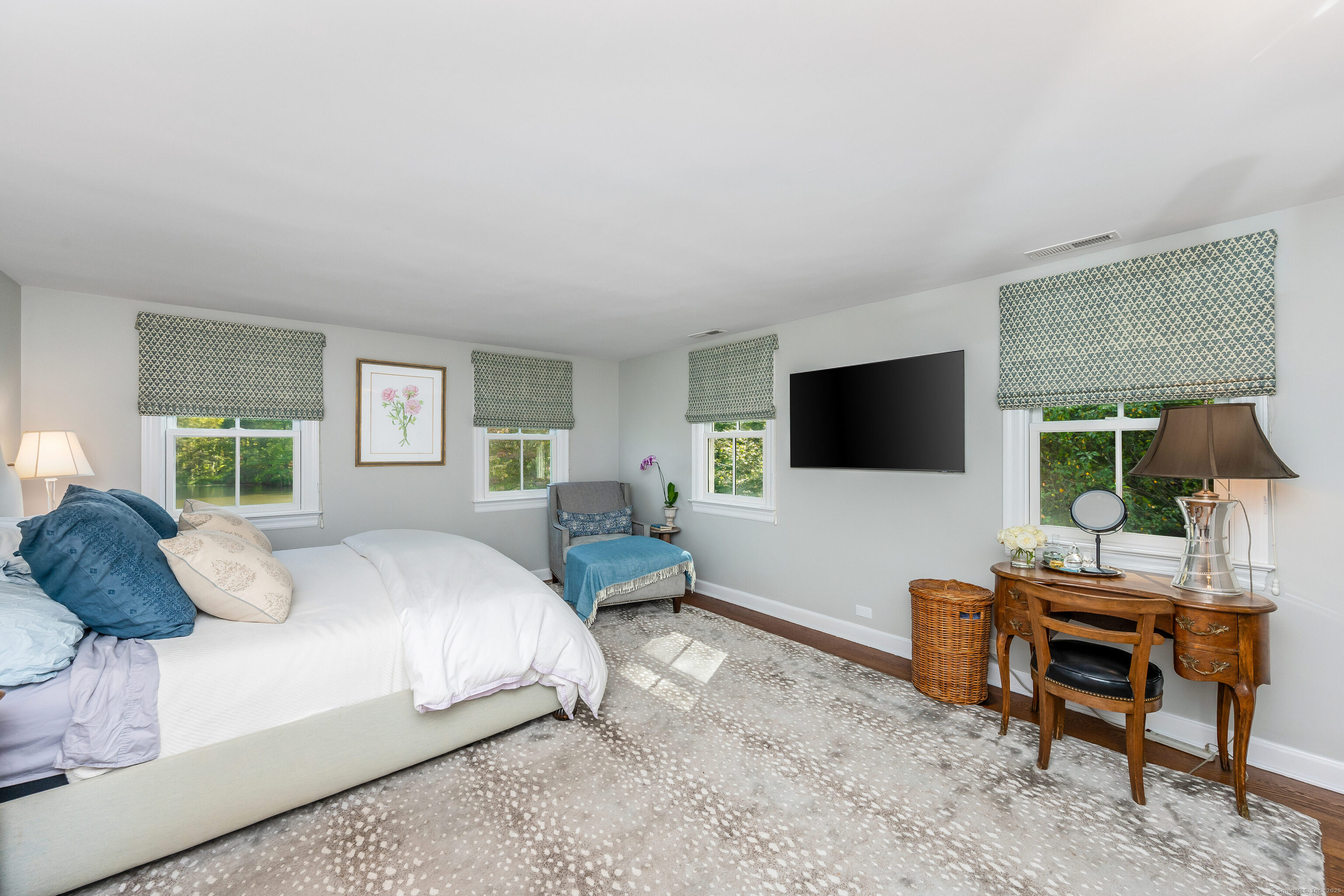 63 Dorchester Road Darien, CT 06820 - Photo 19 of 37 a bedroom with a bed and large window