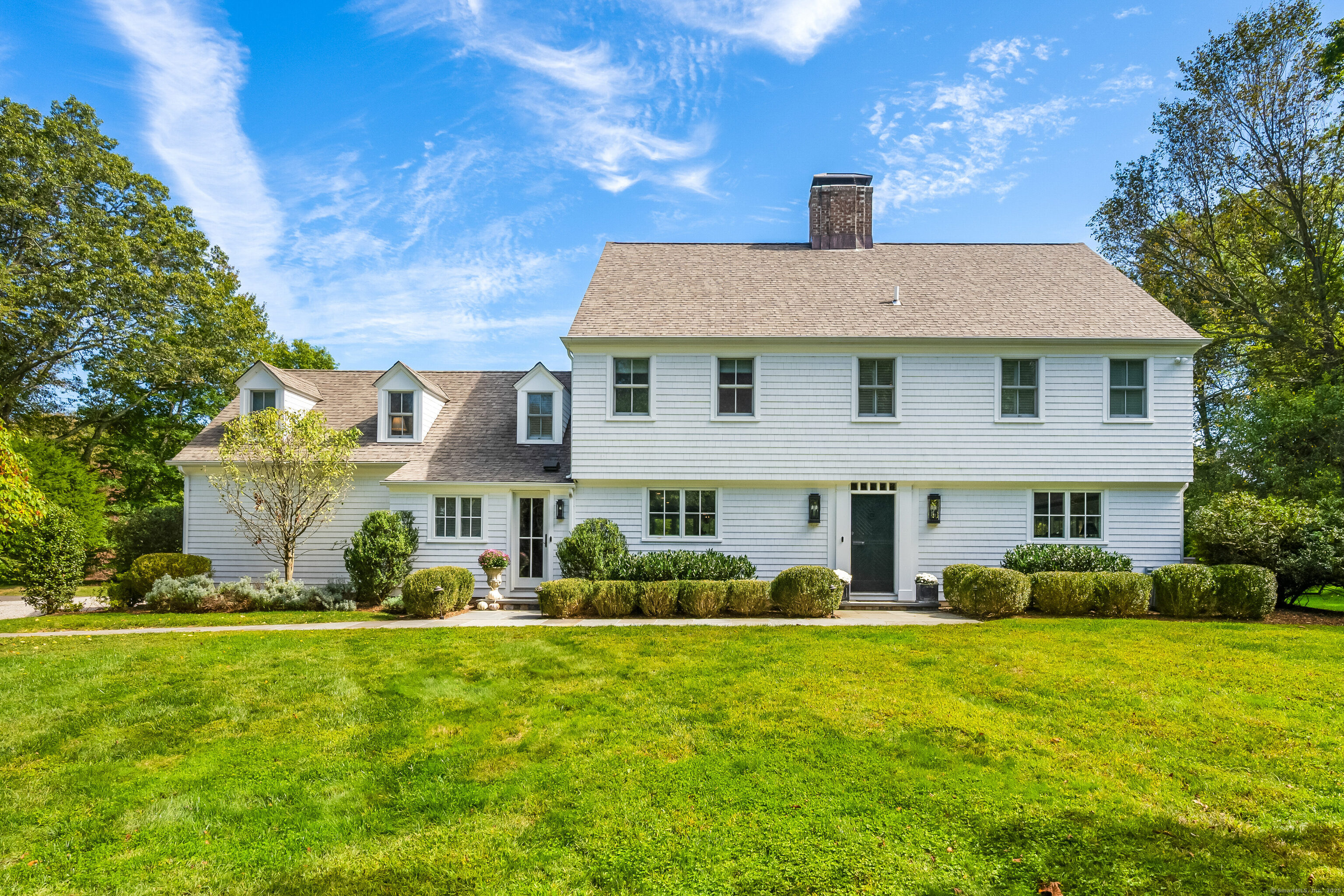 63 Dorchester Road Darien, CT 06820 - Photo 2 of 37 a front view of a house with a yard