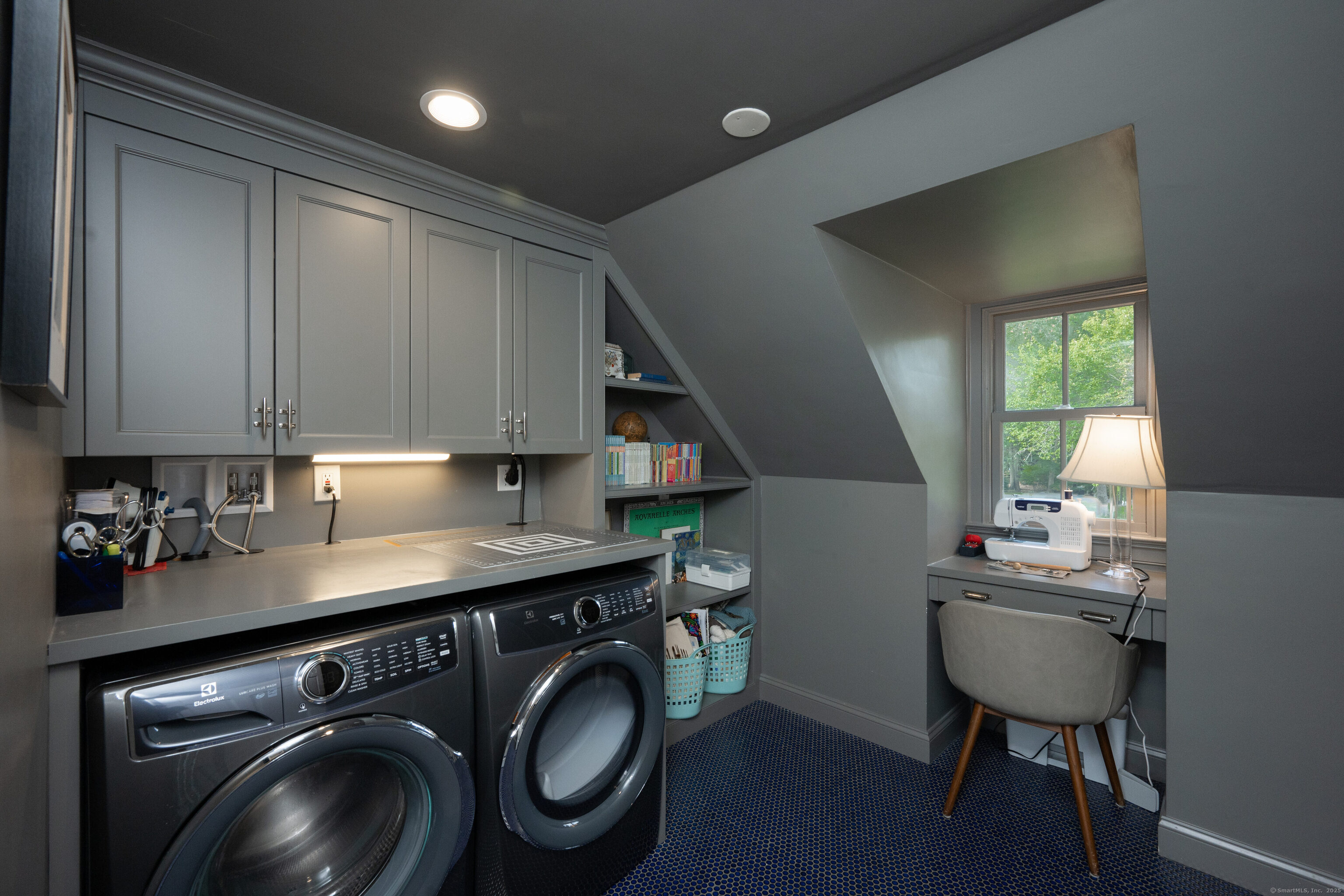 63 Dorchester Road Darien, CT 06820 - Photo 26 of 37 a kitchen with stainless steel appliances a sink a stove cabinets and wooden floor