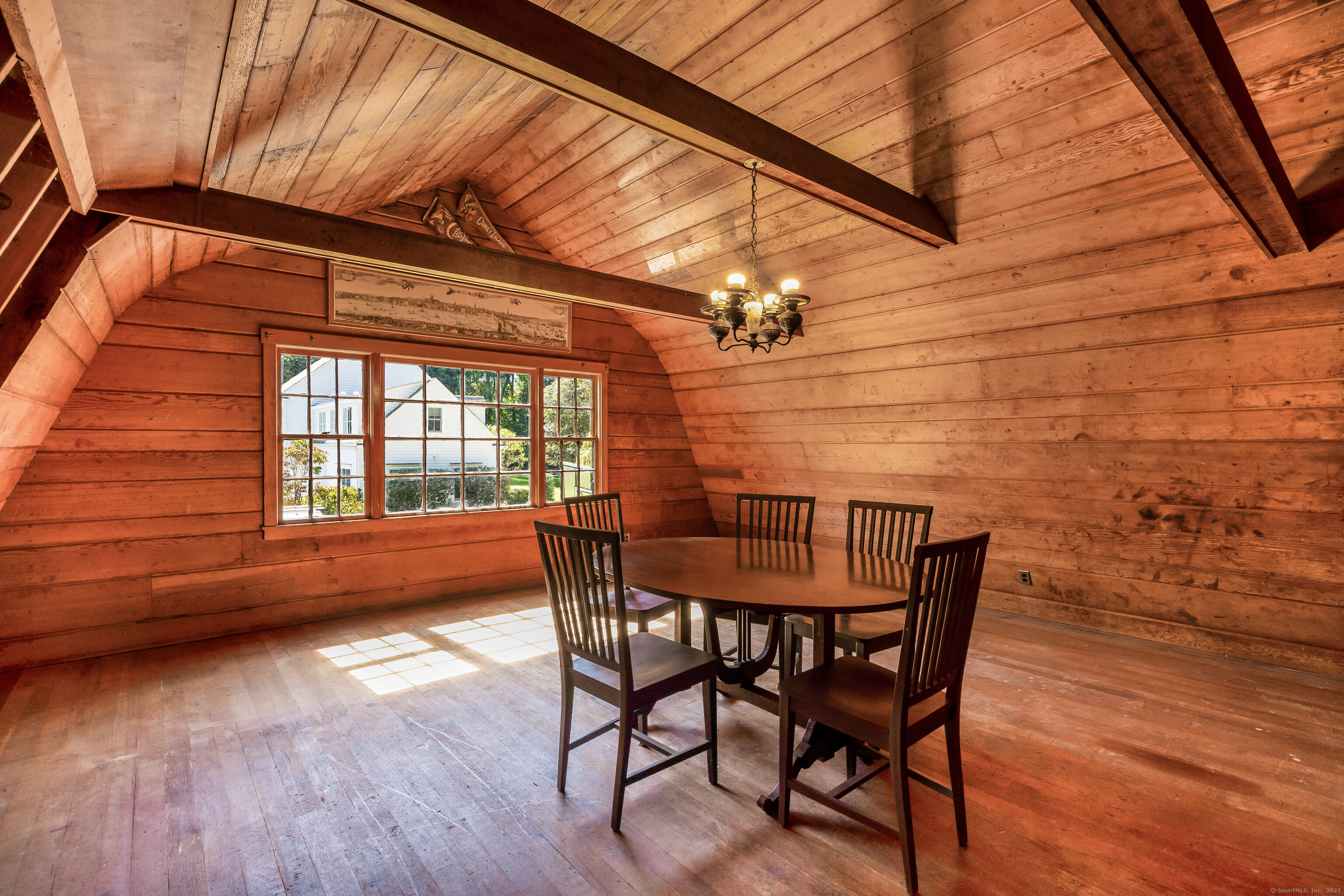 63 Dorchester Road Darien, CT 06820 - Photo 27 of 37 a view of a dining room with furniture and wooden floor