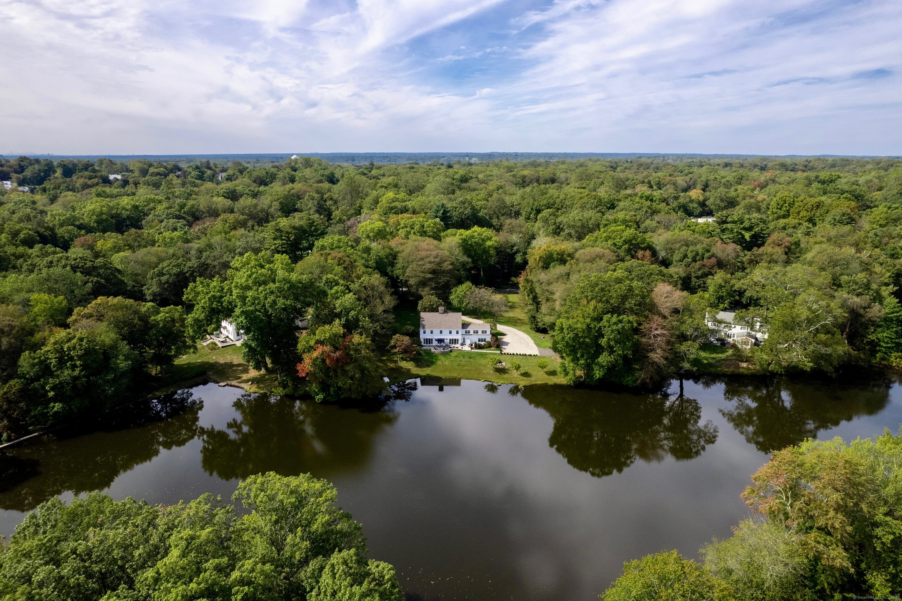 63 Dorchester Road Darien, CT 06820 - Photo 31 of 37 an aerial view of a houses with a lake view