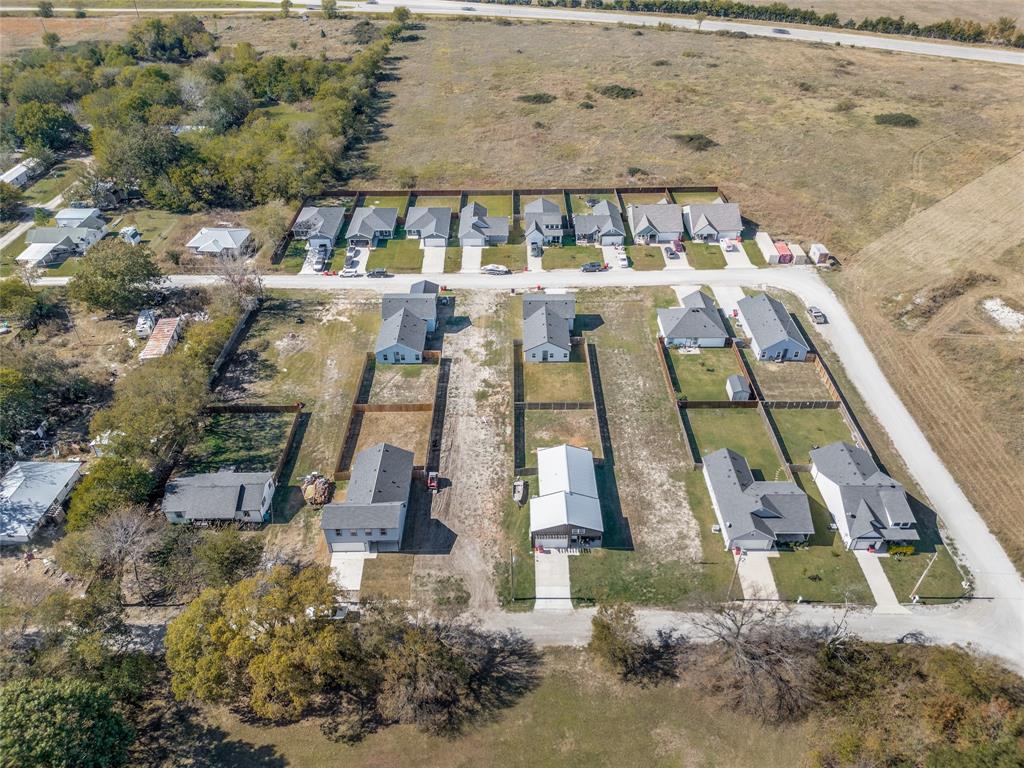 315 North Main Street Trenton, TX 75490 - Photo 5 of 5 an aerial view of a house with a yard