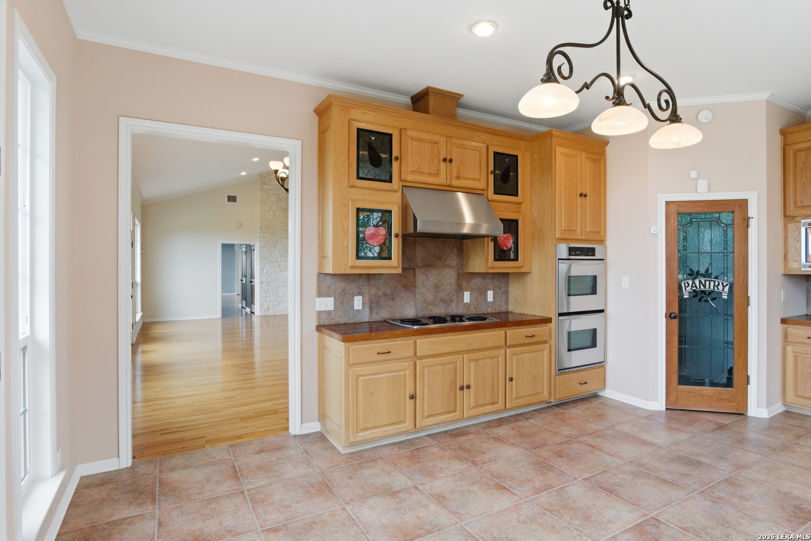 26 Seewald Road Boerne, TX 78006 - Photo 23 of 33 a large kitchen with cabinets and a chandelier