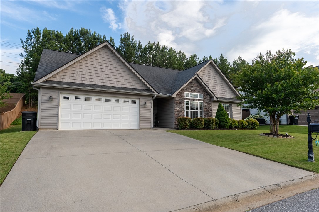 1012 Whirlaway Circle Anderson, SC 29621 - Photo 2 of 25 A classic ranch home showcasing a neat front lawn and a generous concrete driveway.