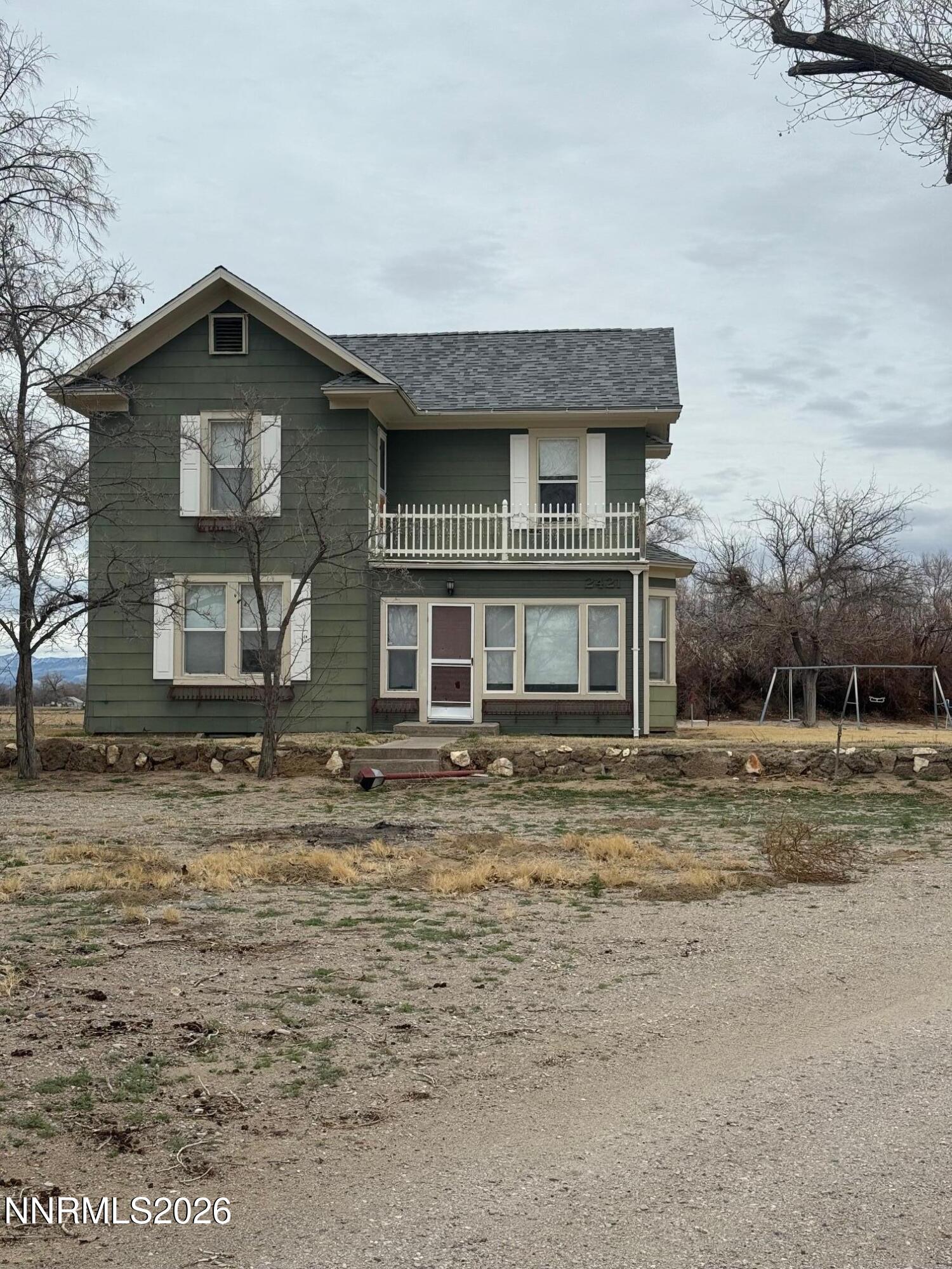 2421 Harrigan Road Fallon, NV 89406 - Photo 1 of 17 a front view of a house with a yard